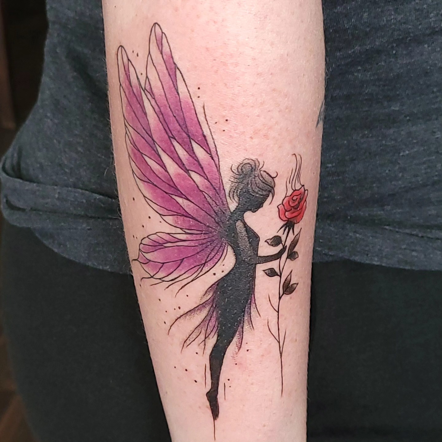 Fairy with rose dotwork tattoo on the forearm by Austin Berry