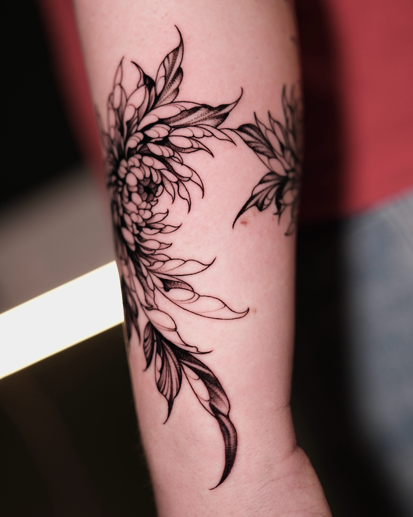 Floral design black and grey tattoo on the forearm by IVY