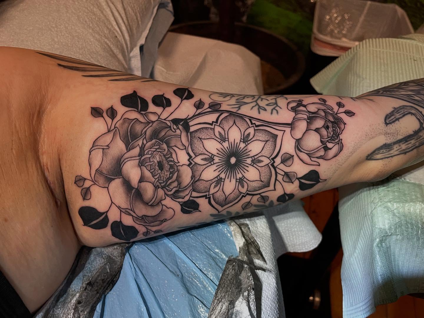 Floral arrangement realism tattoo on the forearm by Lake Stephens, Richmond, Virginia