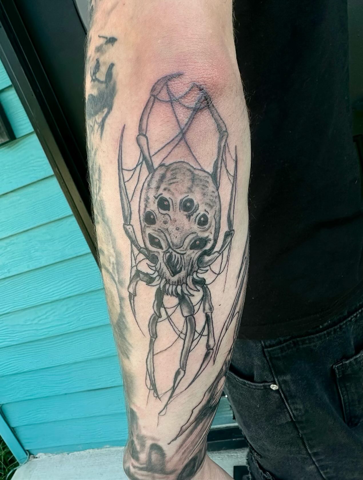 Spider geometric tattoo on the forearm by Mika'la Berry