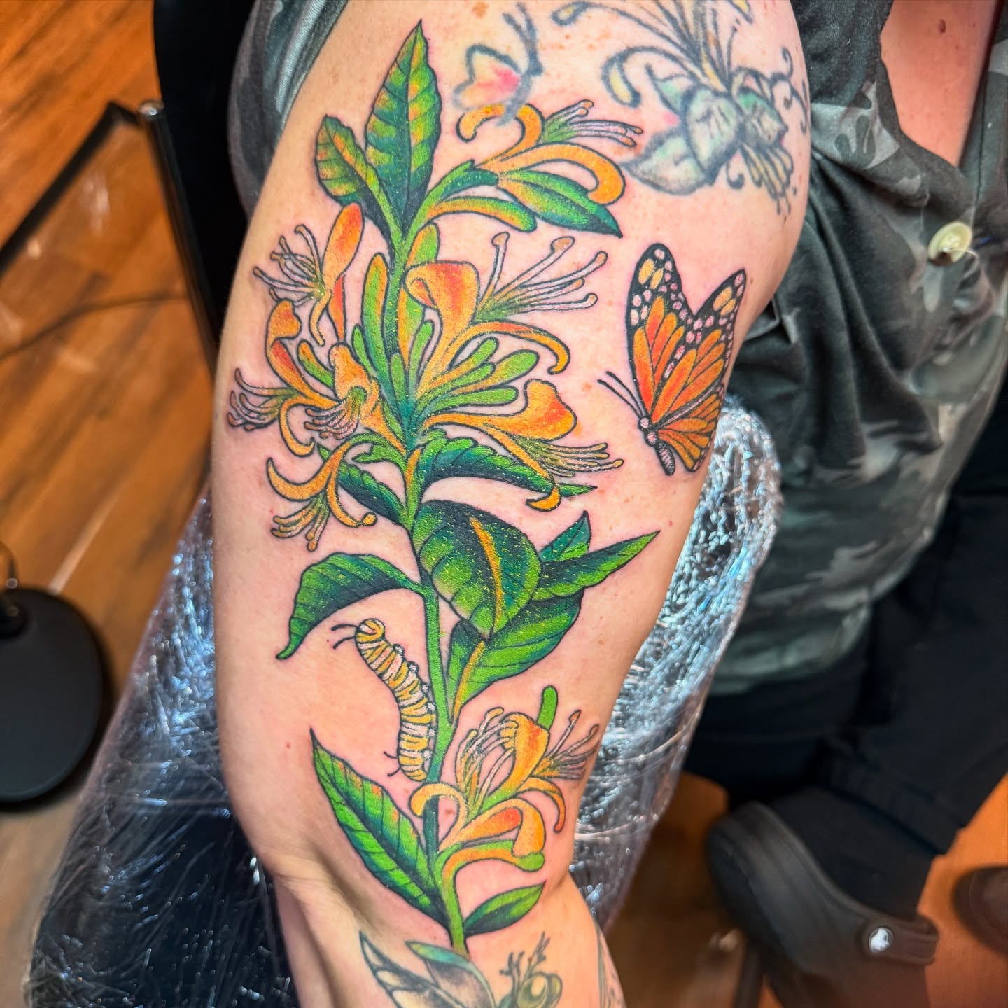 Monarch butterfly and honeysuckle new school tattoo on the forearm by Angus Perfect, Philadelphia, Pennsylvania