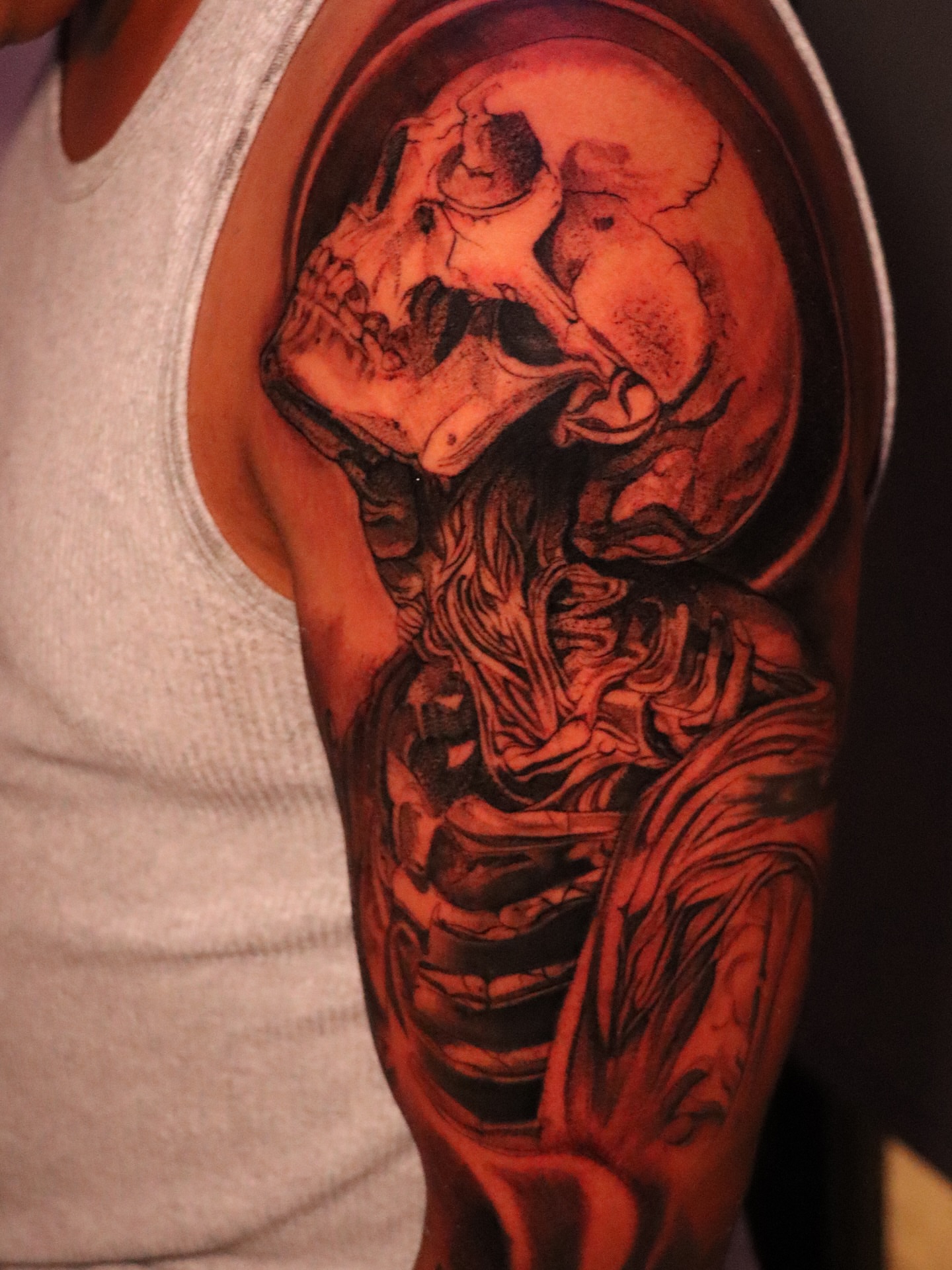 Skull realism tattoo on the upper arm by elvis flores
