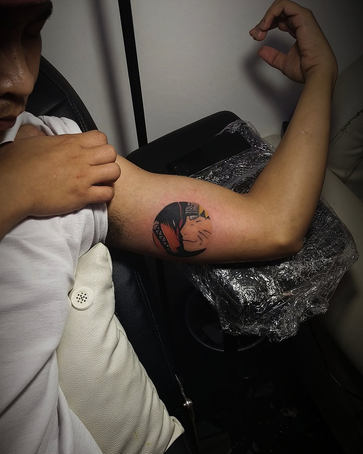 Anime character anime tattoo on the forearm by Peter John