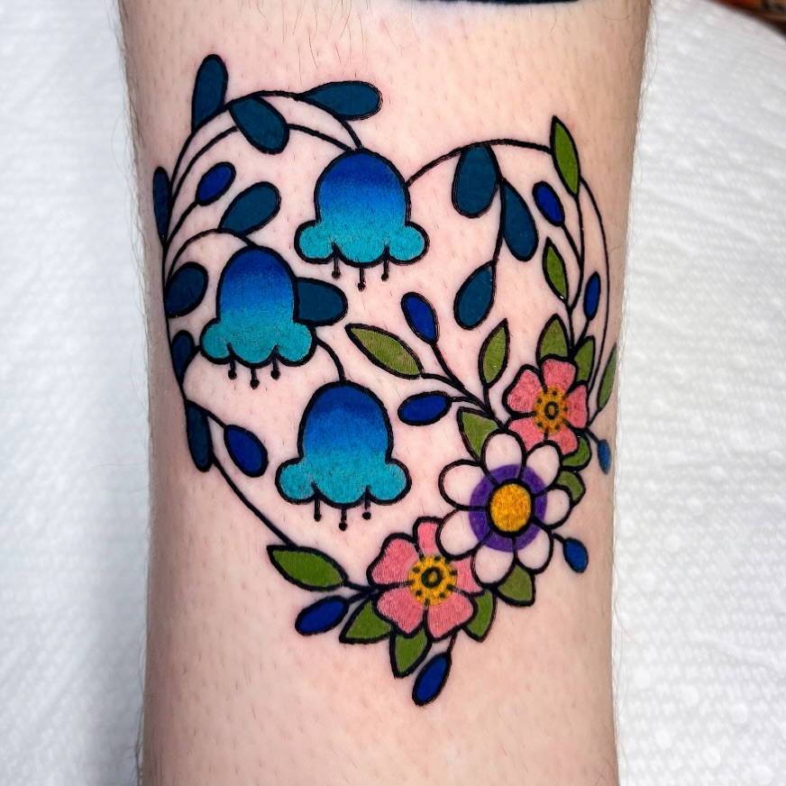 Floral heart new school tattoo on the forearm by Alena McDonald
