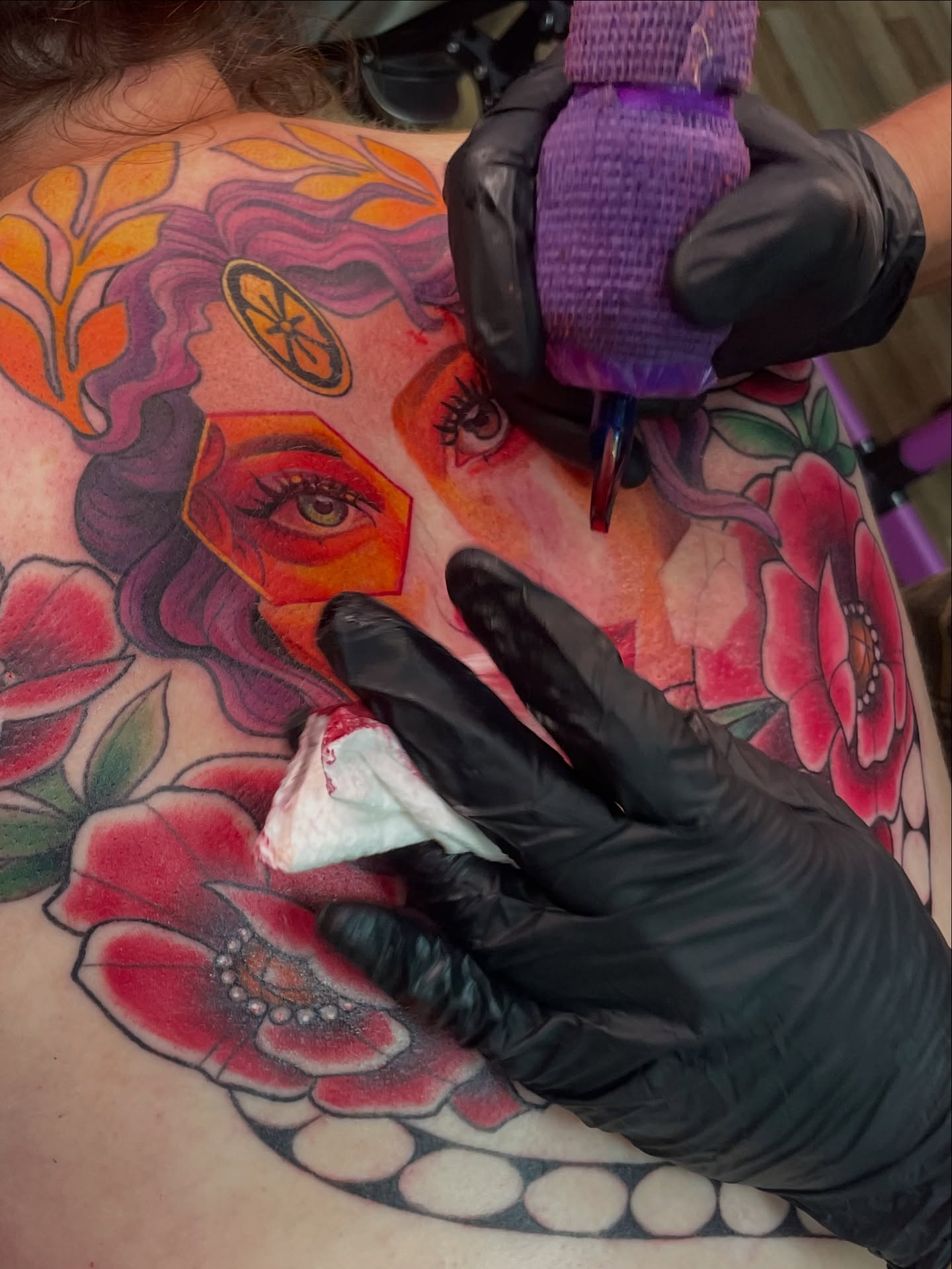 Woman's face American traditional tattoo on the back by Mando Castro