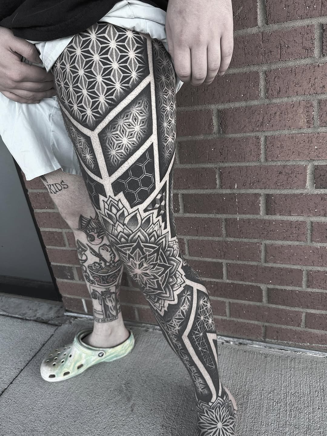 Geometric patterns and mandala geometric tattoo on the leg by Anna Nicole Thomas