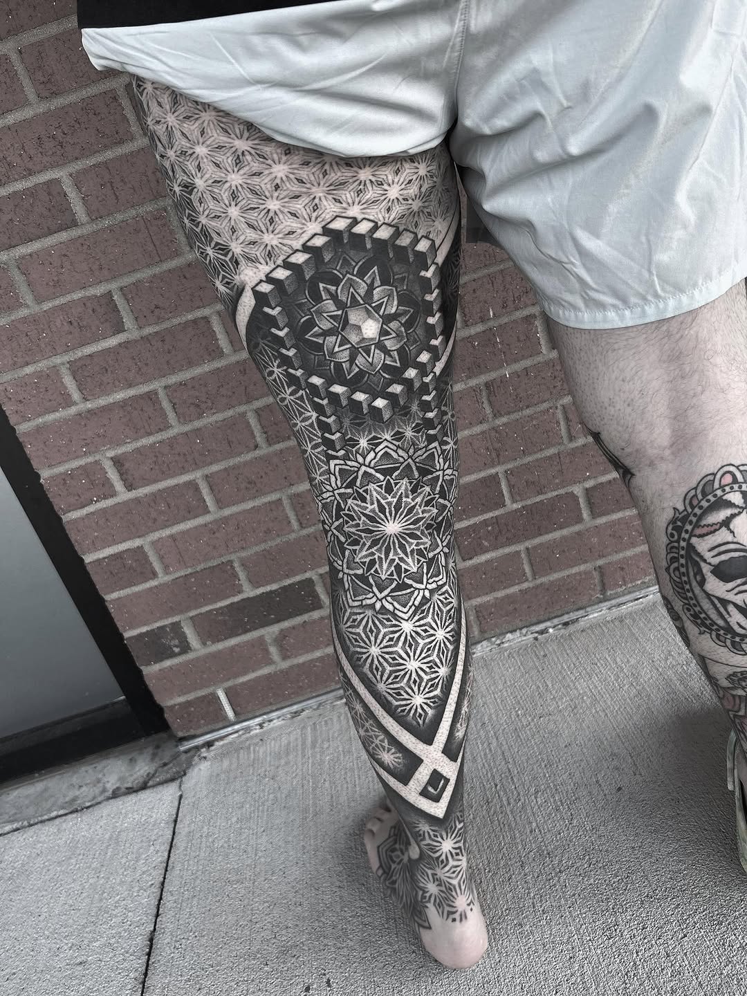 Geometric pattern leg sleeve geometric tattoo on the leg by Anna Nicole Thomas