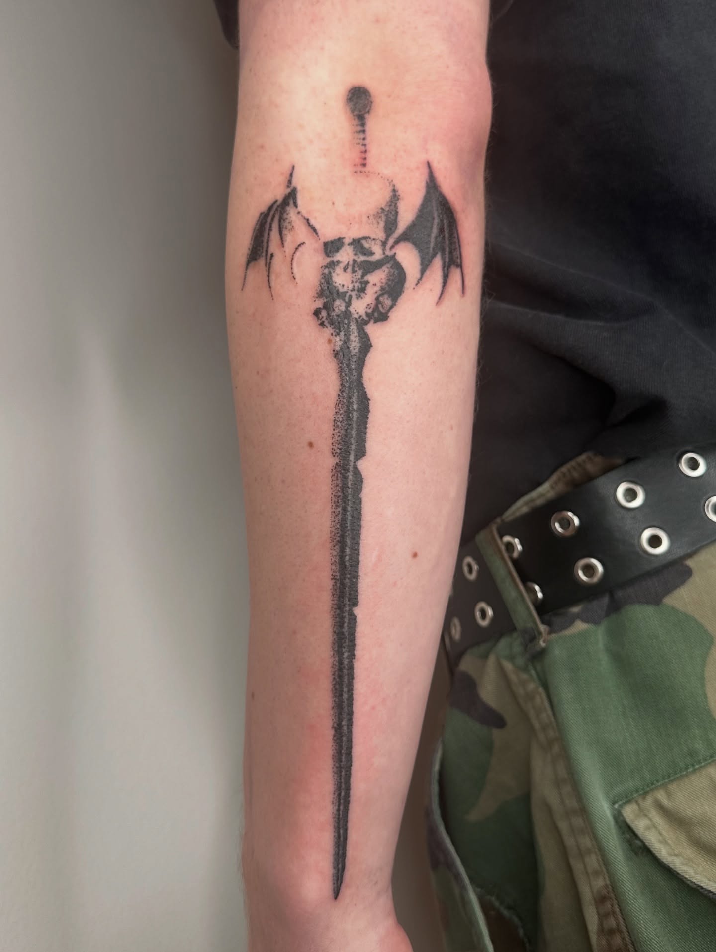 Demon sword black and grey tattoo on the forearm by πΈππππππ