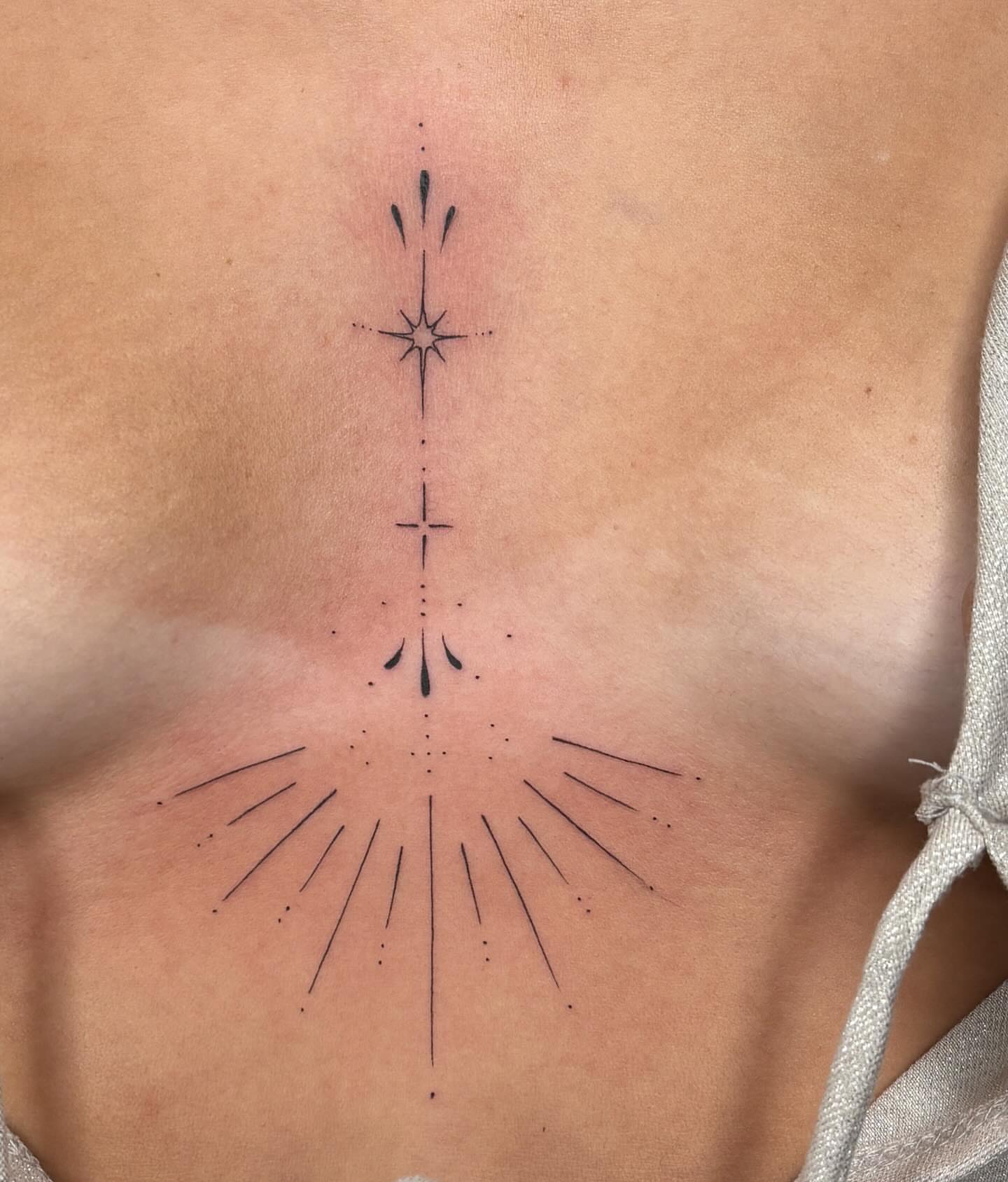 Geometric design dotwork tattoo on the chest by alyssa doing tattoos