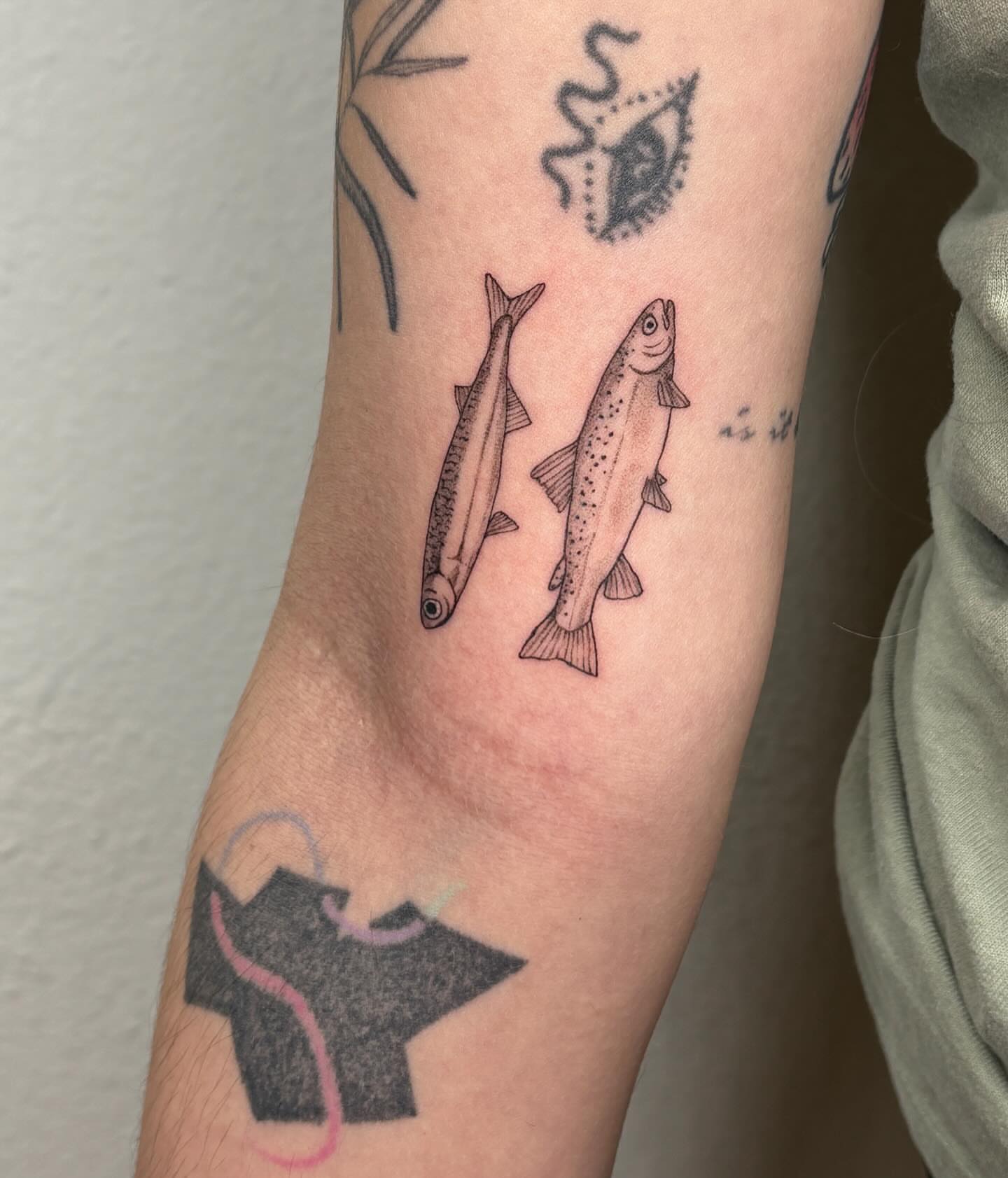 Fishes realism tattoo on the forearm by alyssa doing tattoos