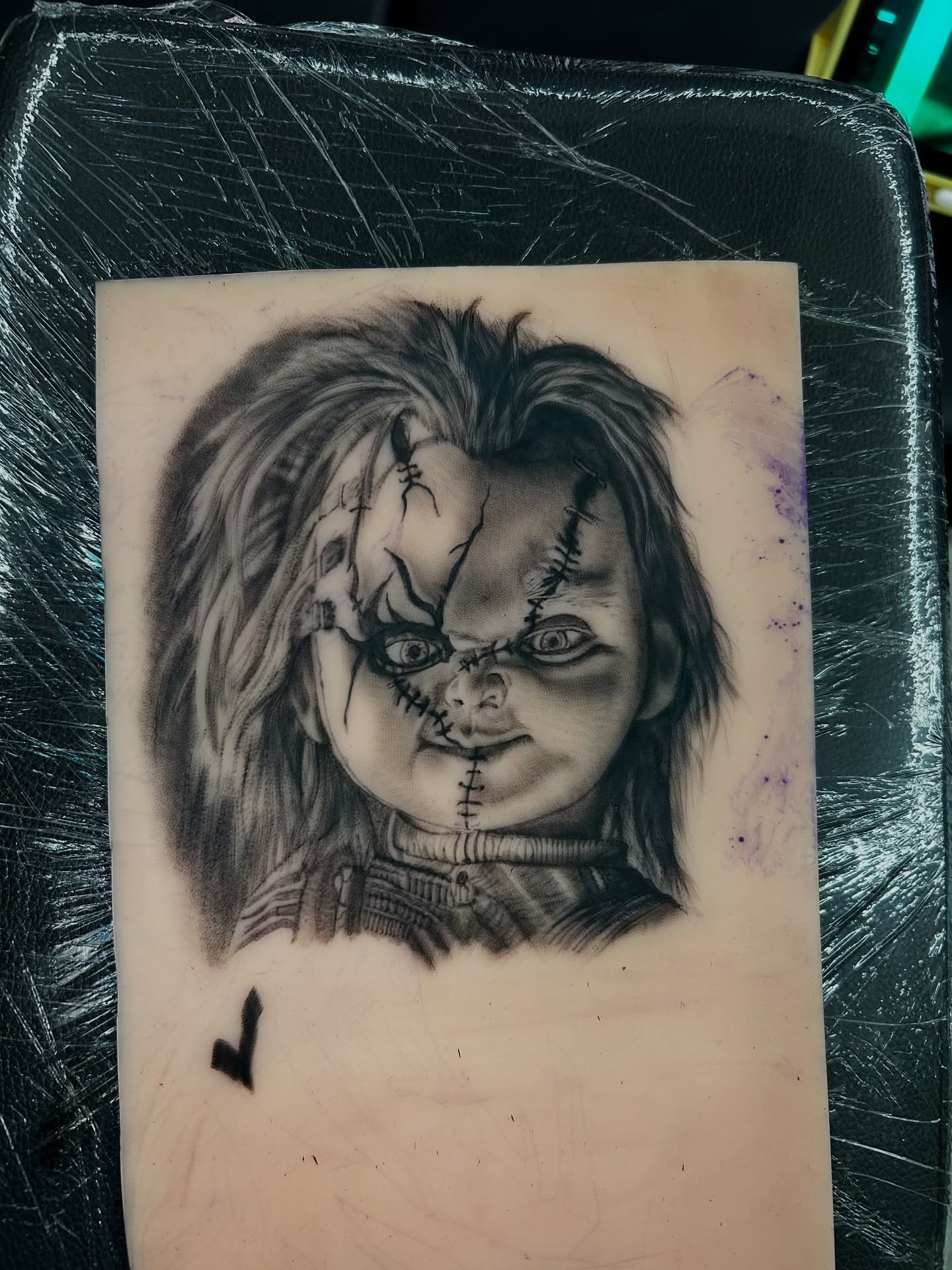 Chucky doll black and grey tattoo on the forearm by Melissa C, Phoenix, Arizona