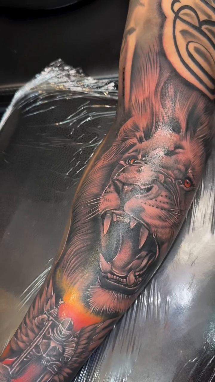 Lion head with tribal elements realism tattoo by Licensed Tattoo Artist πΈπ»
