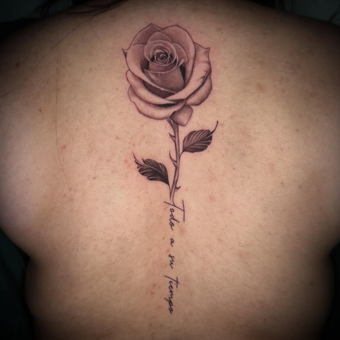 Rose black and grey tattoo on the back by Geo