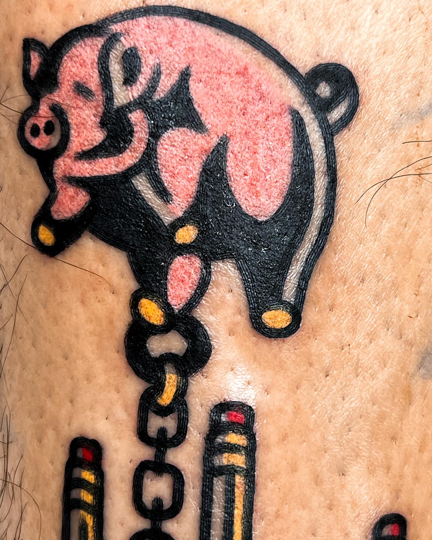 Pig American traditional tattoo on the upper arm by Oldschool Tattooer Takii 타키