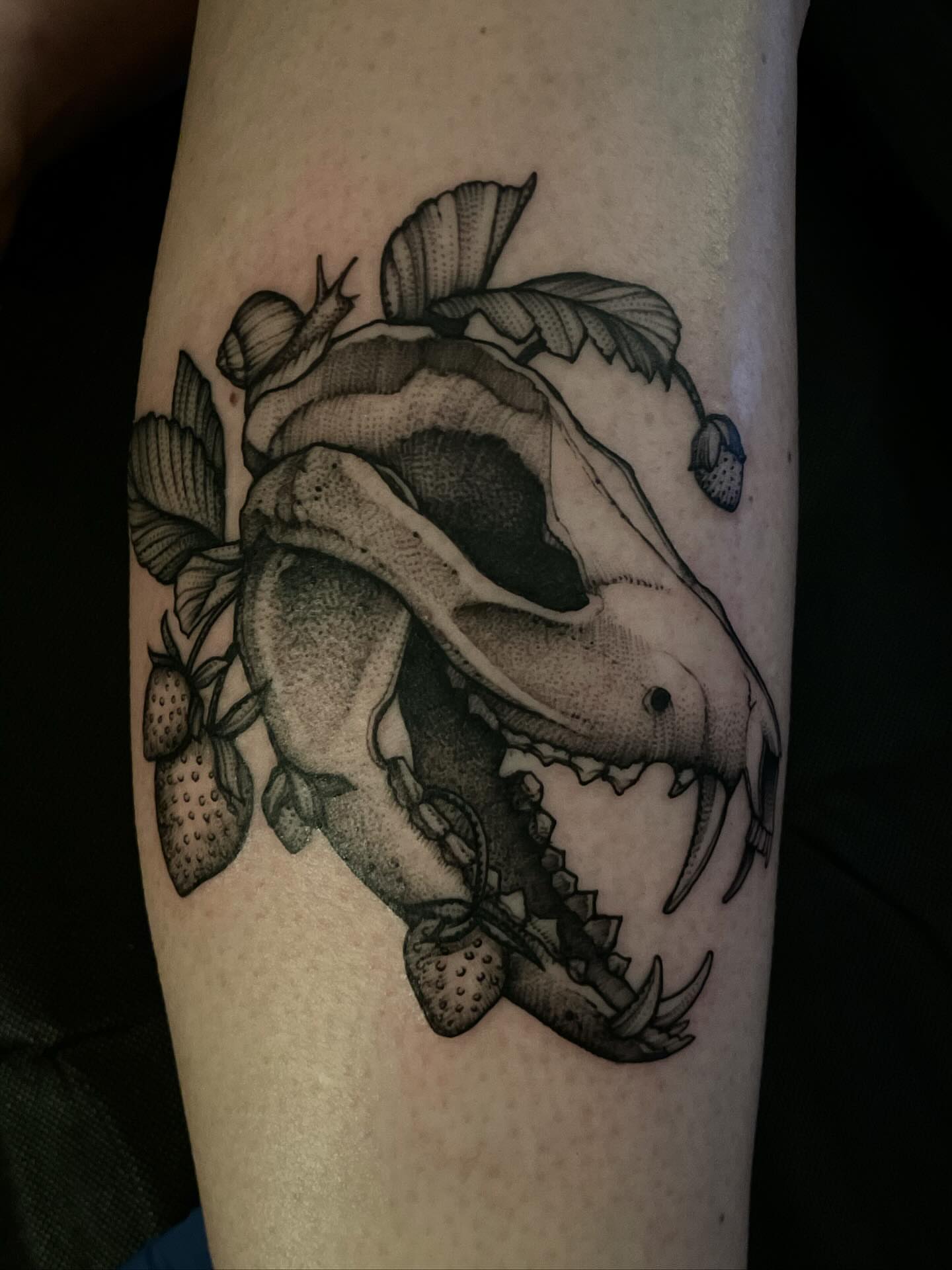 Strawberry monster realism tattoo on the forearm by Jacob Kearney