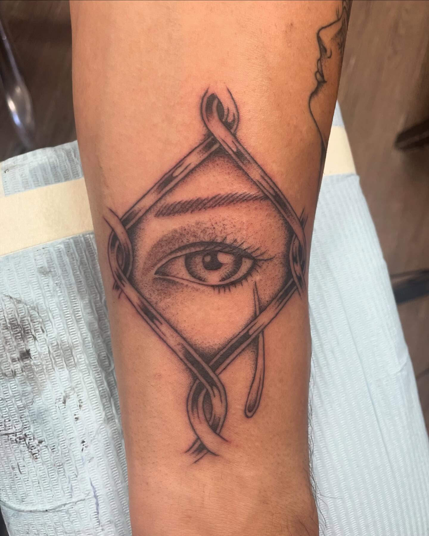Eye with triangle dotwork tattoo on the forearm by Brayden P Tattoo