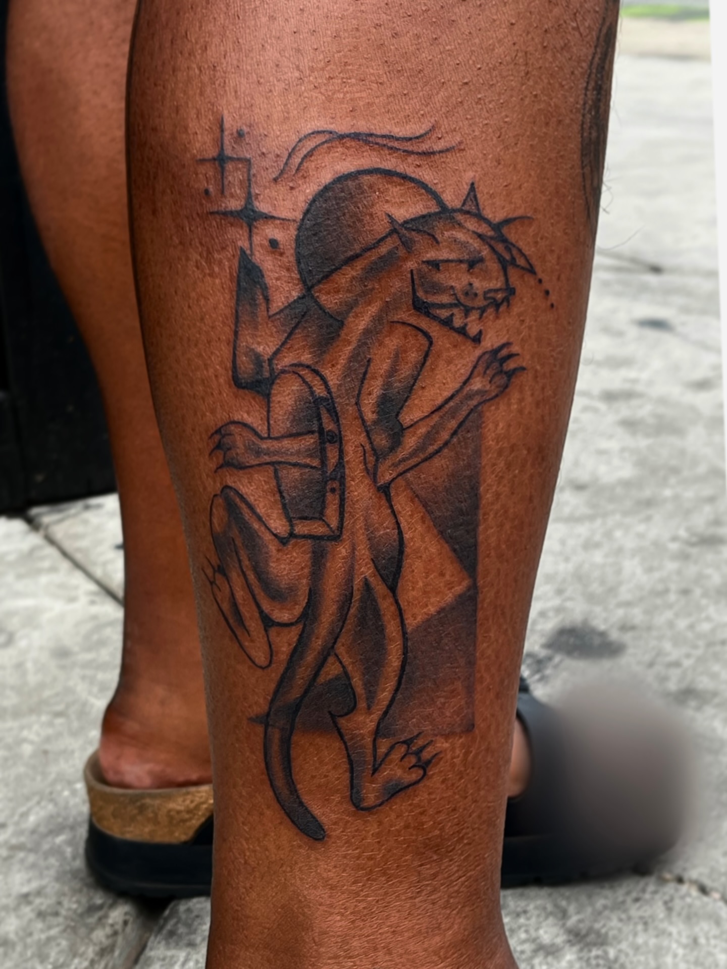 Lion and human geometric tattoo on the calf by Wes Rose-Moon