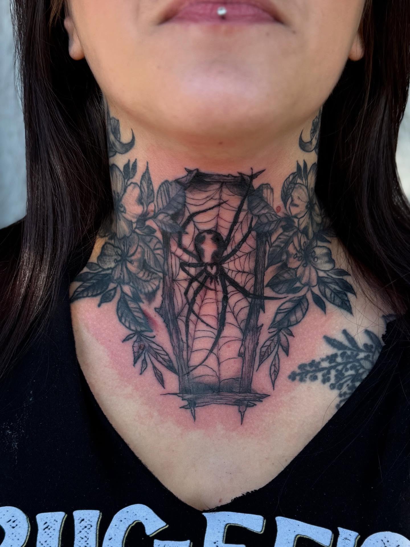Spider web black and grey tattoo on the neck by Tattoos By Trish