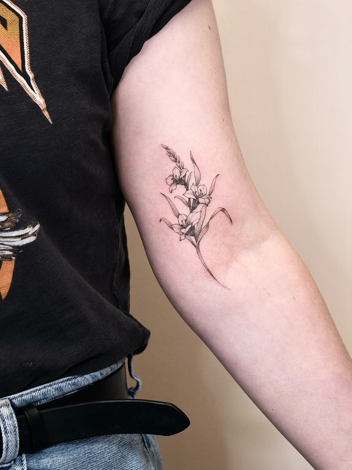 Flowers black and grey tattoo on the forearm by Your tattoo Artist, New York, New York