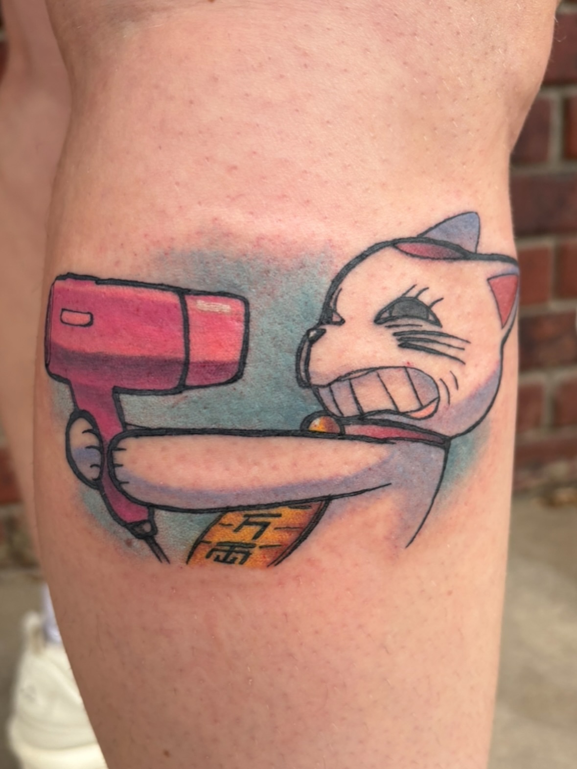 Cat with drill American traditional tattoo on the thigh by Gabby