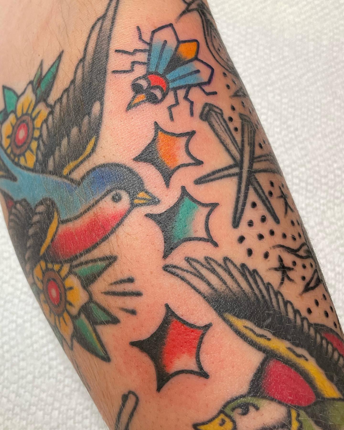Bird and floral American traditional tattoo on the forearm by nancy❣️