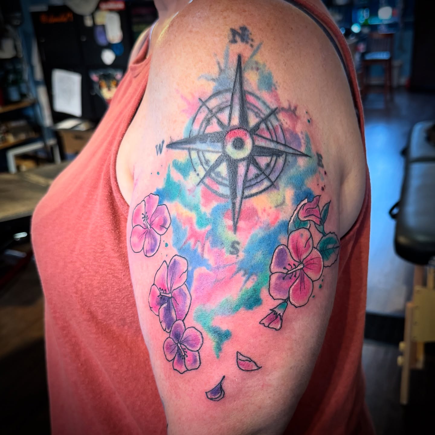 Compass and flowers watercolor tattoo on the shoulder by Misty Dawn Brothers, Dayton, Ohio