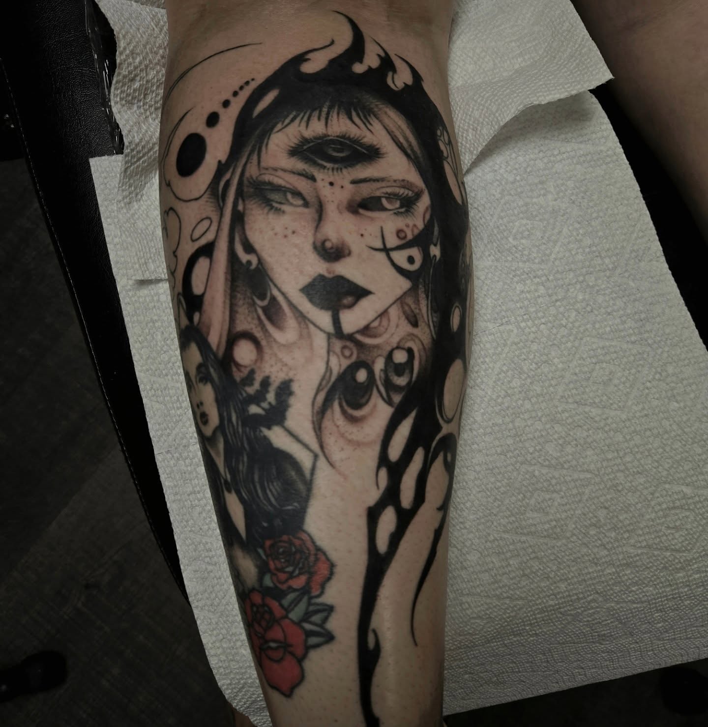 Woman with roses realism tattoo on the forearm by Ema Fish