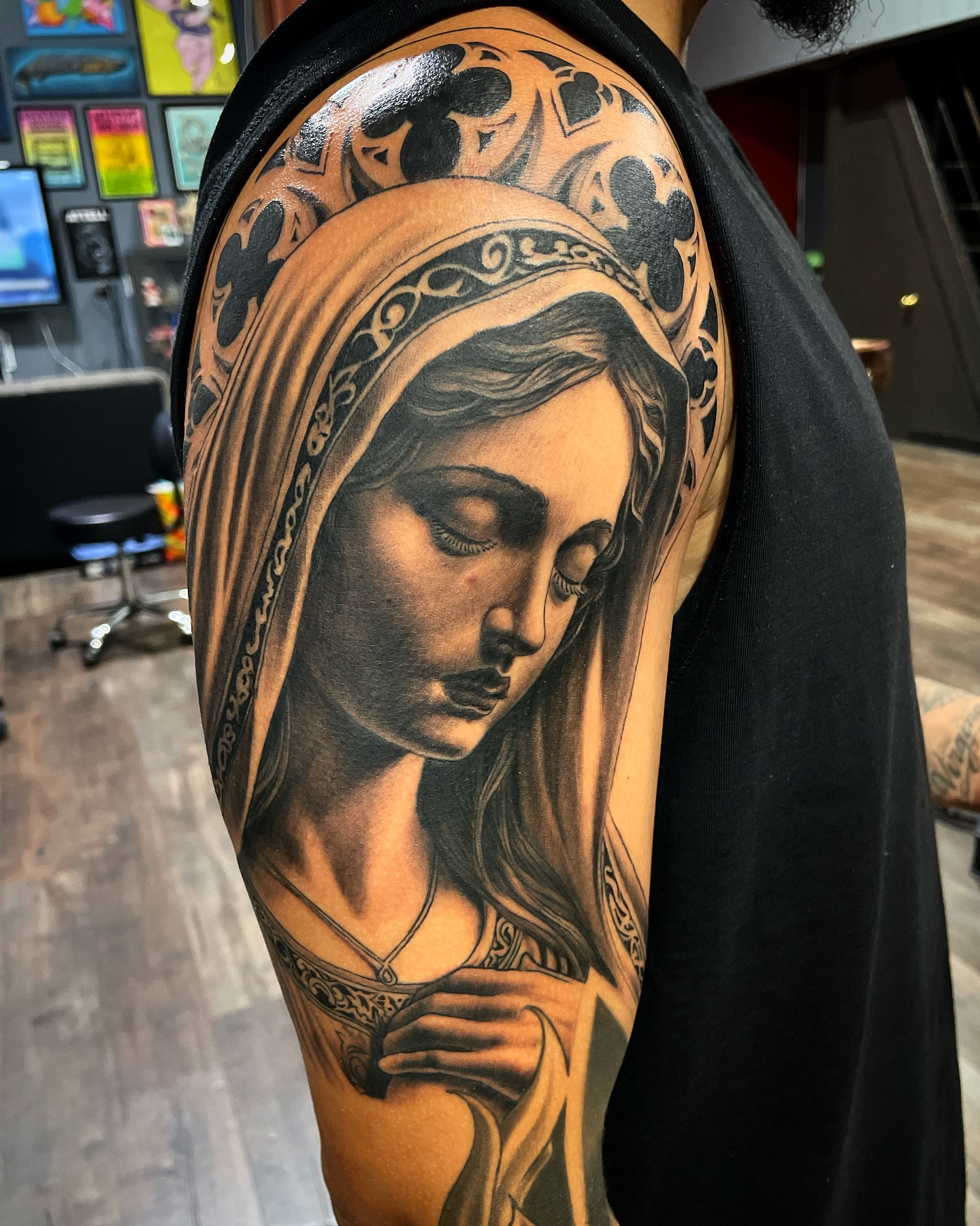 Woman with veil realism tattoo on the shoulder by Alex Ortiz