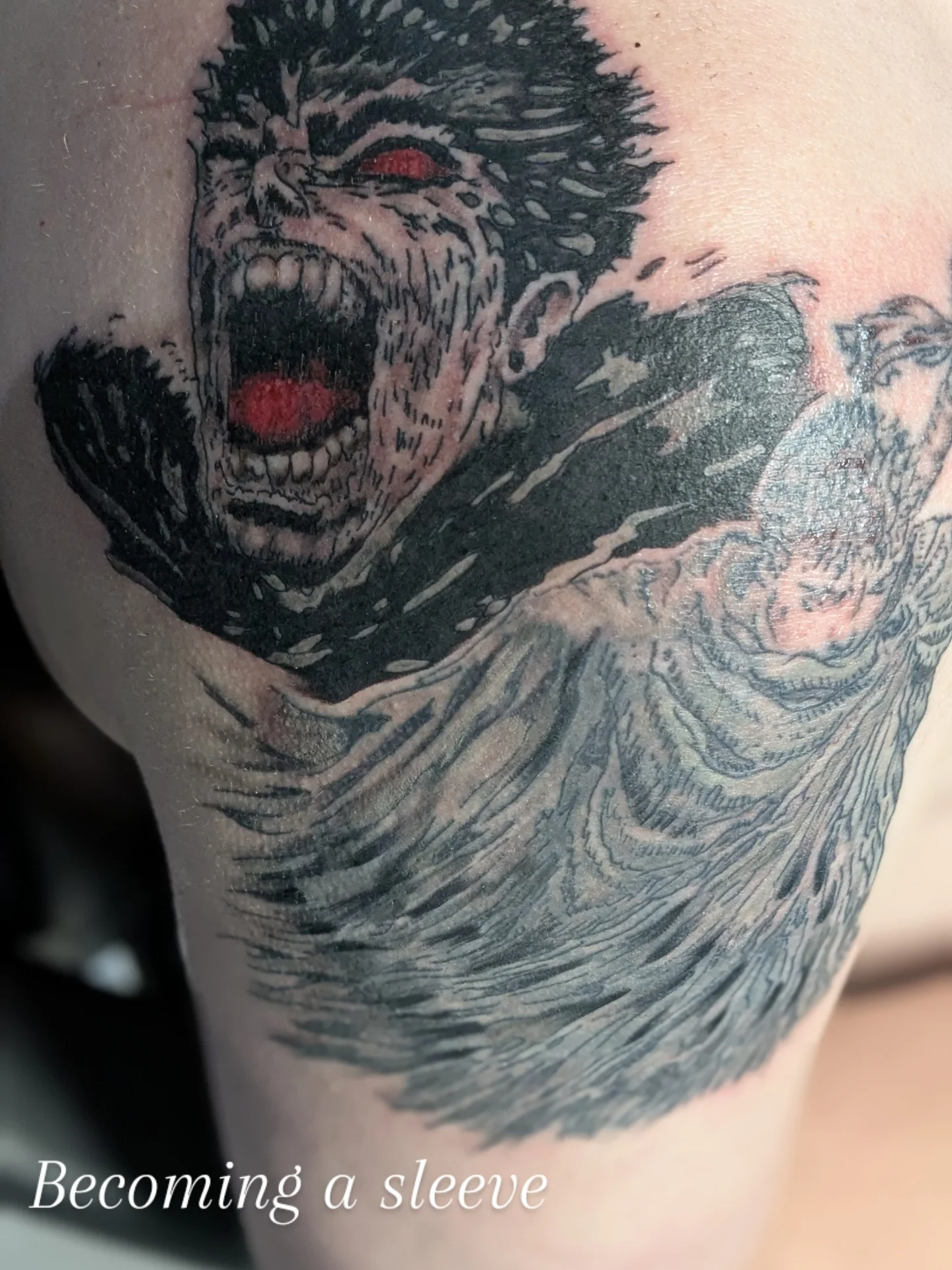 Screaming face dark realism tattoo on the upper arm by Bobby Batts, Chesterfield, Virginia