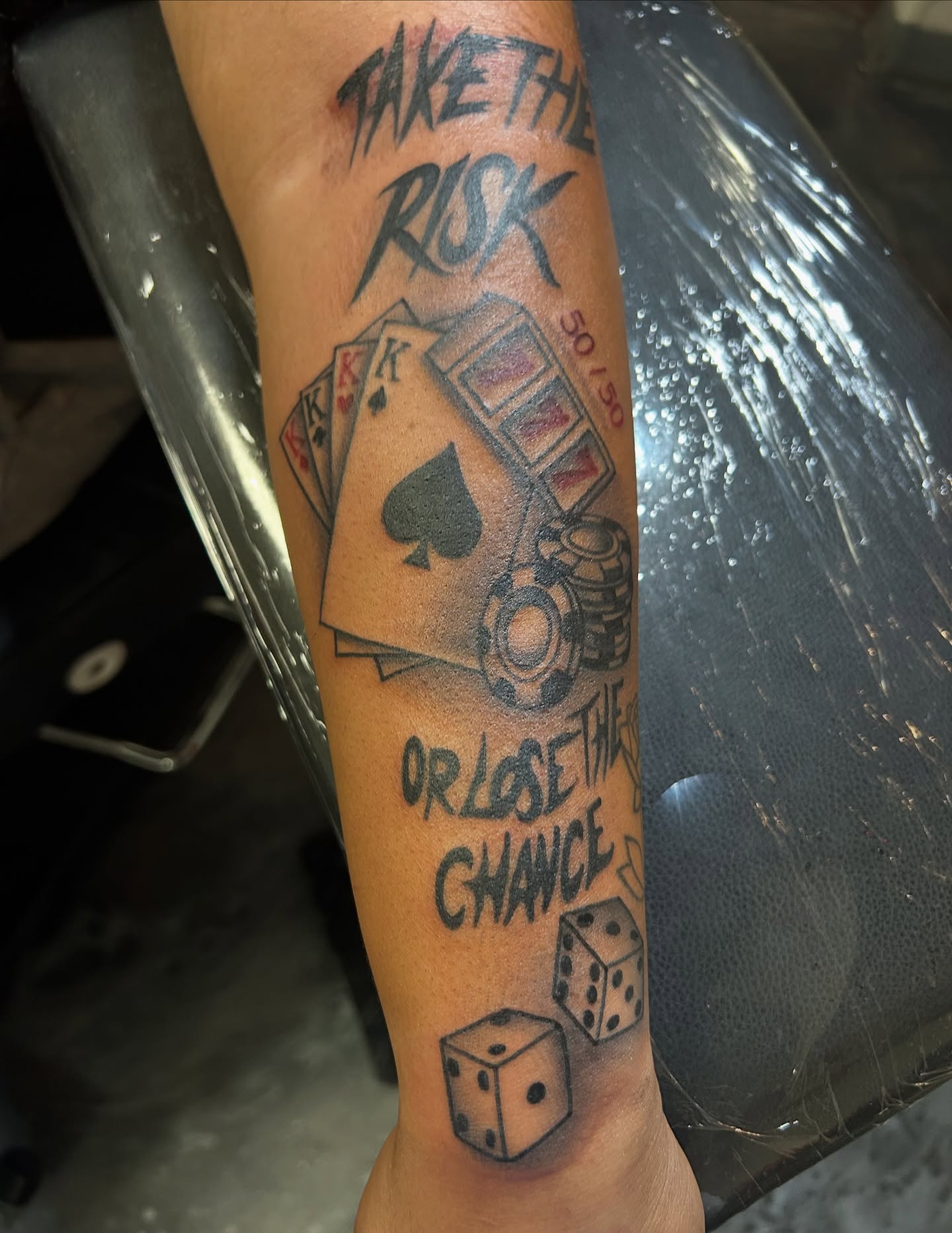 Gambling theme black and grey tattoo on the forearm by Tattoos by Corey aka MrLu