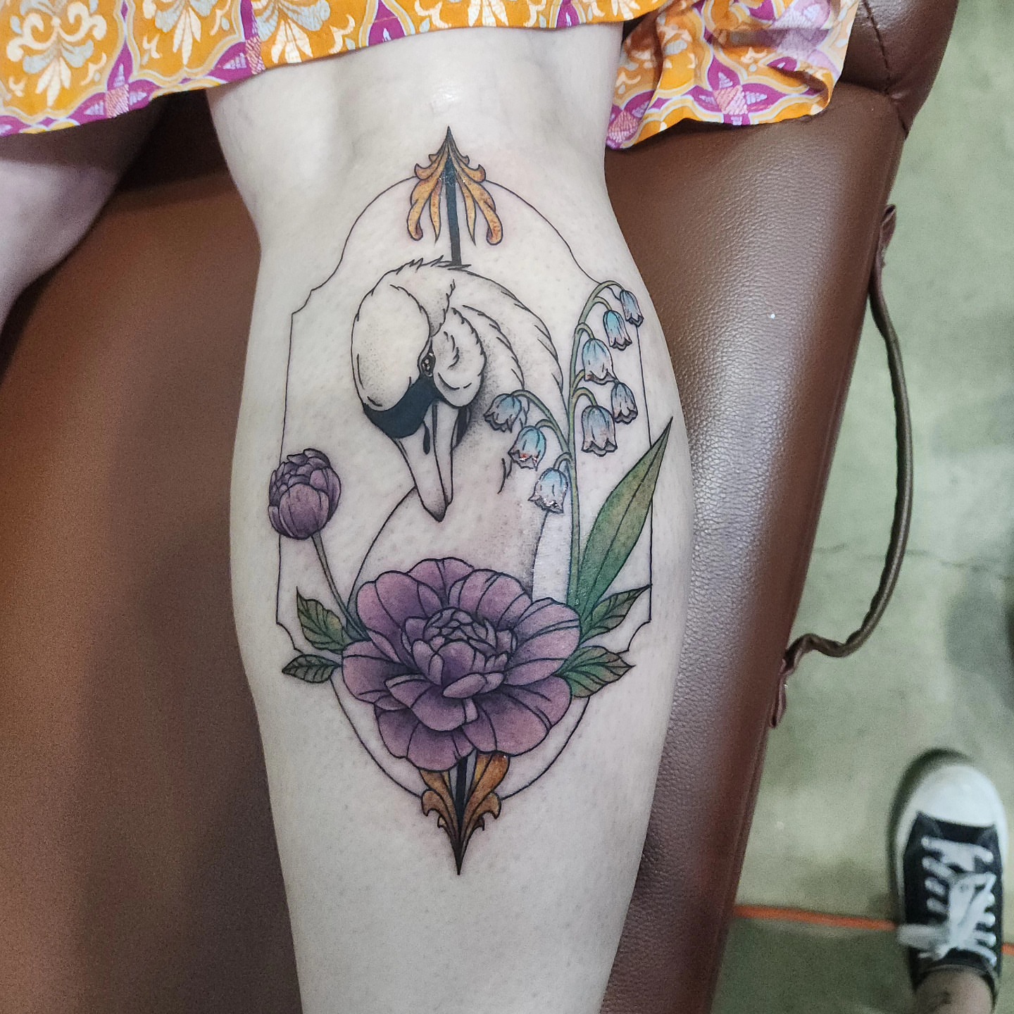 Swan and flowers American traditional tattoo on the thigh by Hope Powell, Vancouver, Washington