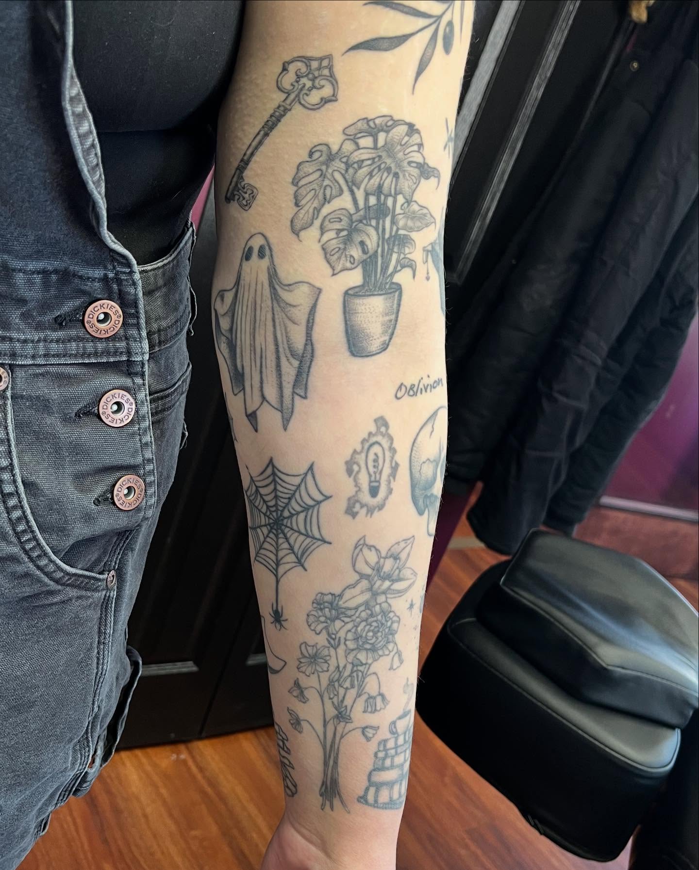 Ghost and plant black and grey tattoo on the forearm by Kelli Donegan ๐ท