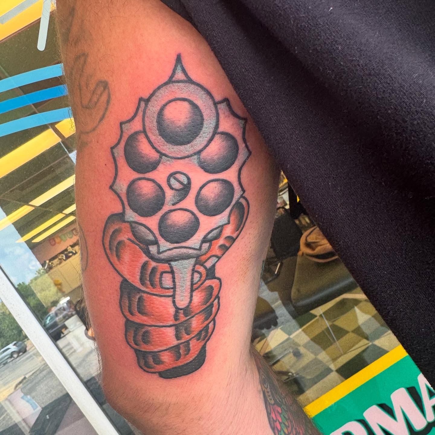 Grenade dotwork tattoo on the forearm by Atom Aker
