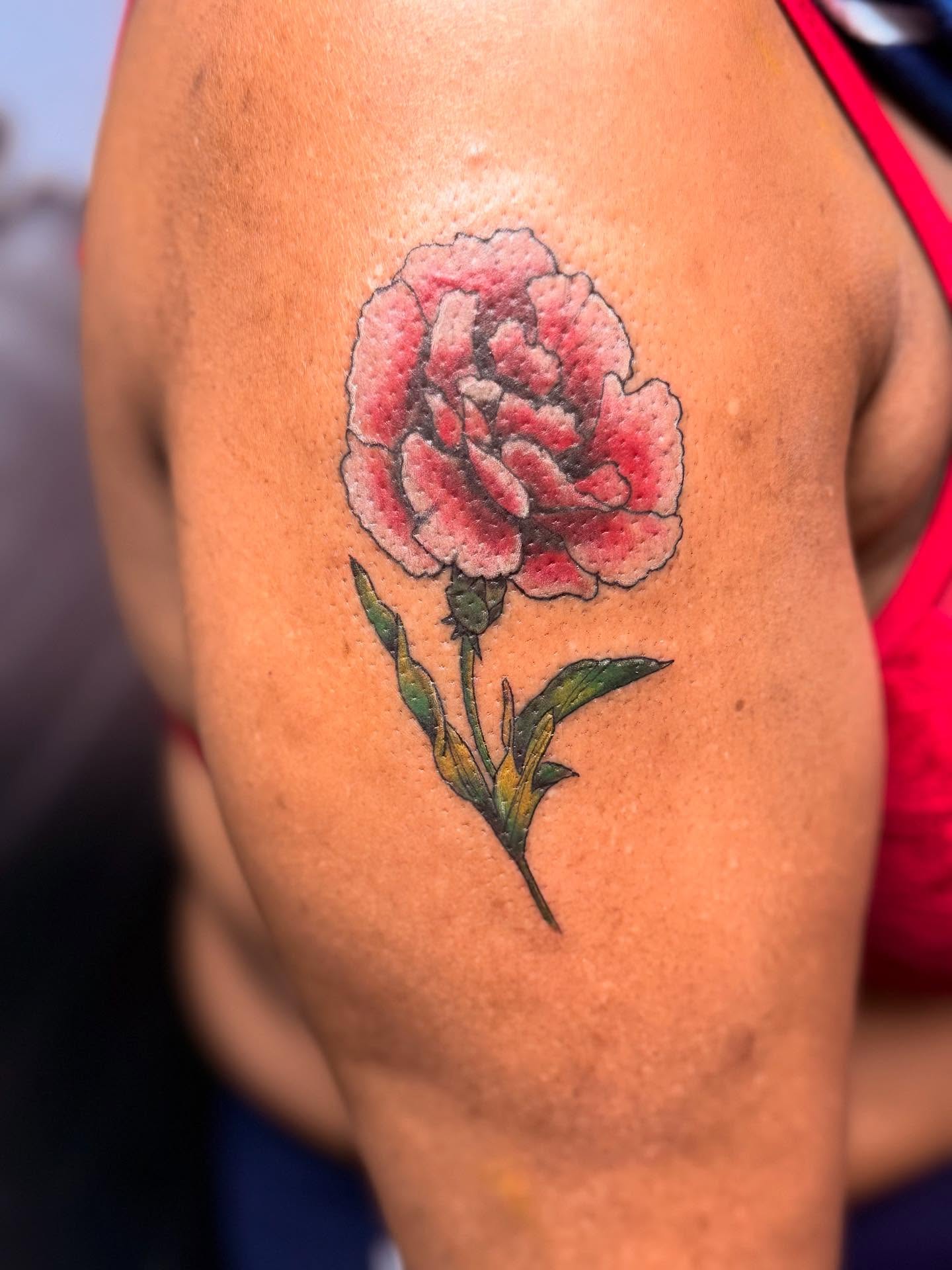 Peony watercolor tattoo on the upper arm by dotMX