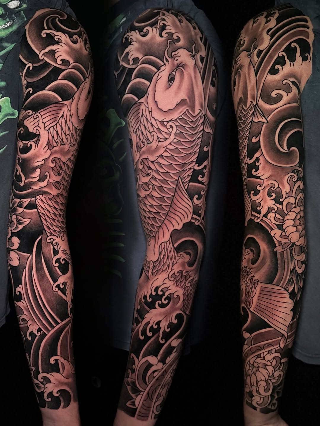 Koi fish and waves Japanese tattoo on the upper arm by Matt Trimble, Charlotte, North Carolina