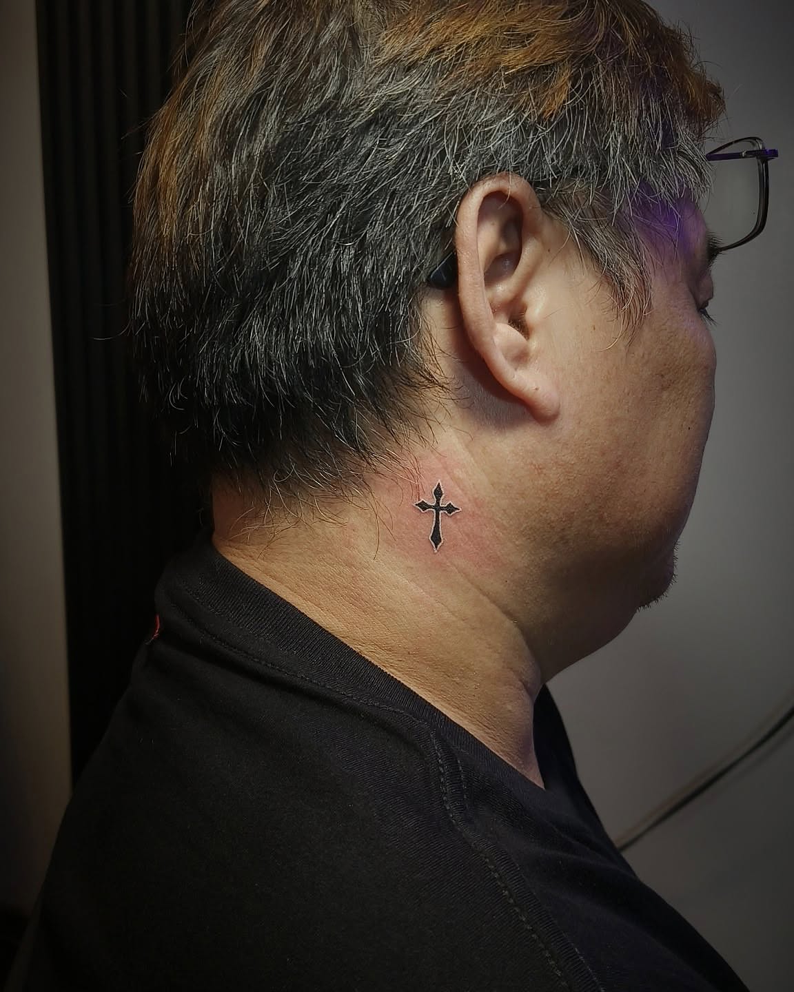 Cross black and grey tattoo on the neck by Peter John