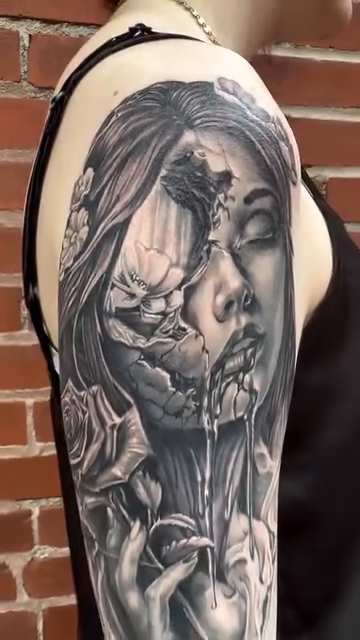 Woman with cracked face and roses dark realism tattoo by Blake Van Vleck