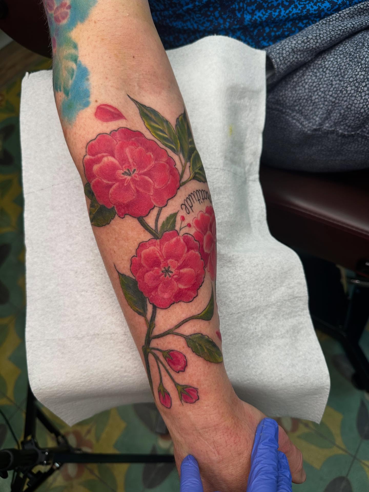 Cherry blossoms American traditional tattoo on the forearm by Heather Tattoos Danvers MA