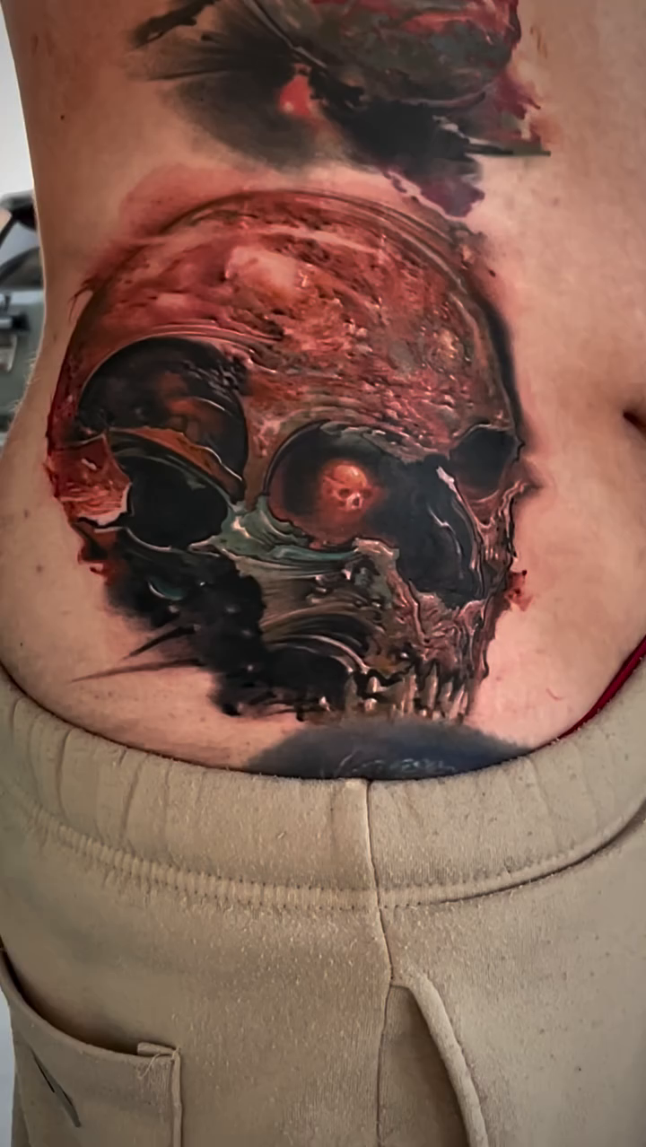 Skull with roses realism tattoo by Robert Hernandez