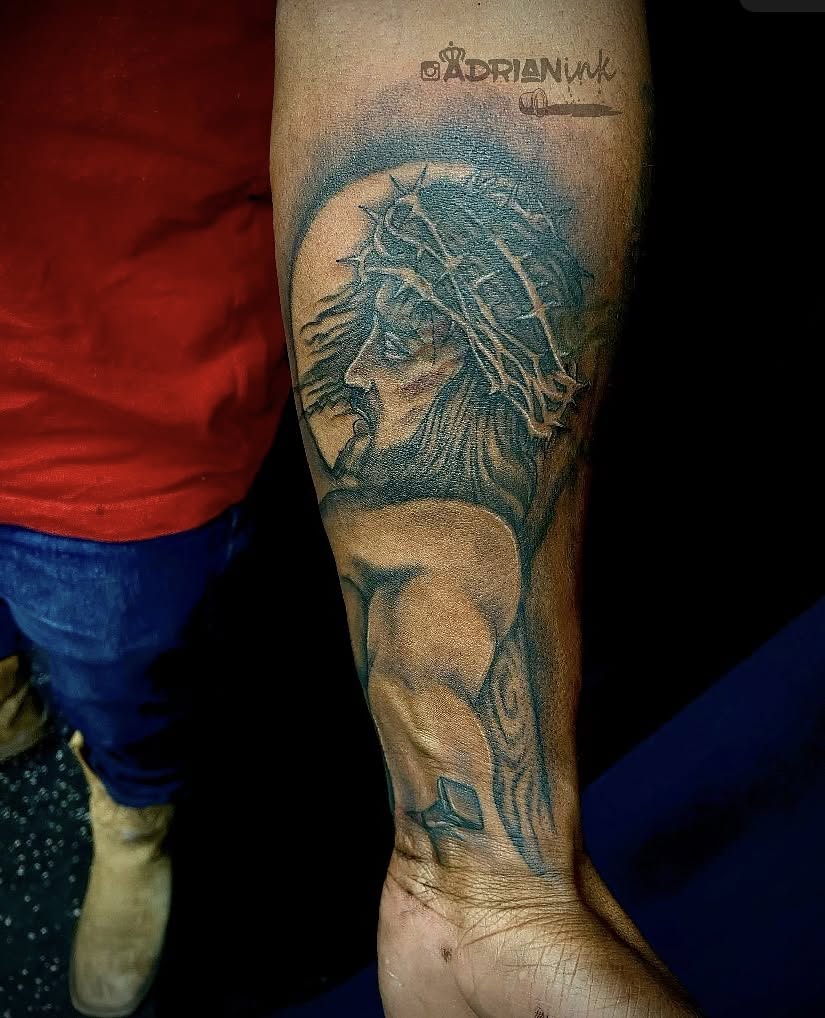 Jesus Christ realism tattoo on the forearm by Adrian Shan Carr