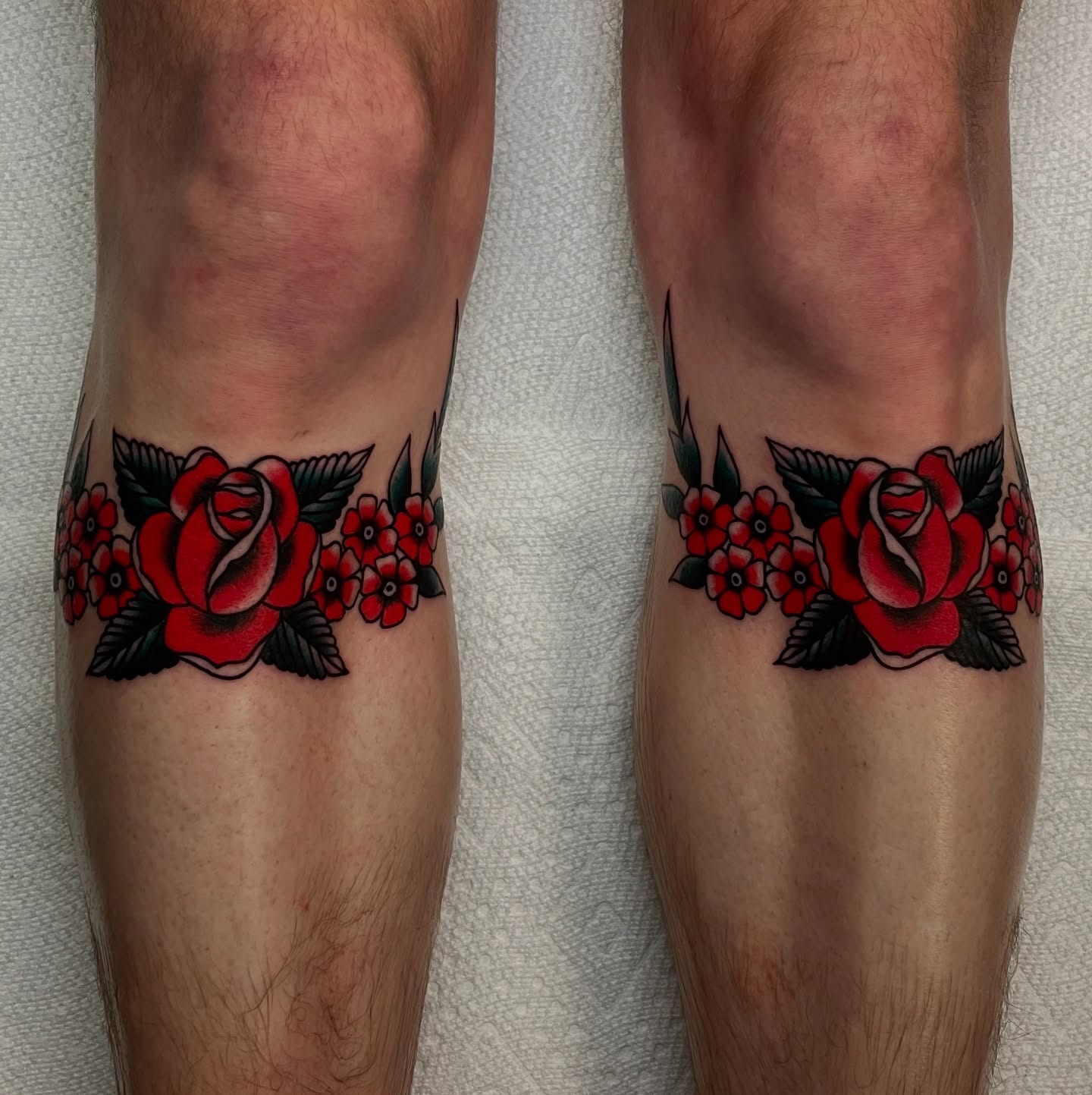 Red roses American traditional tattoo on the calf by Texas Jonah