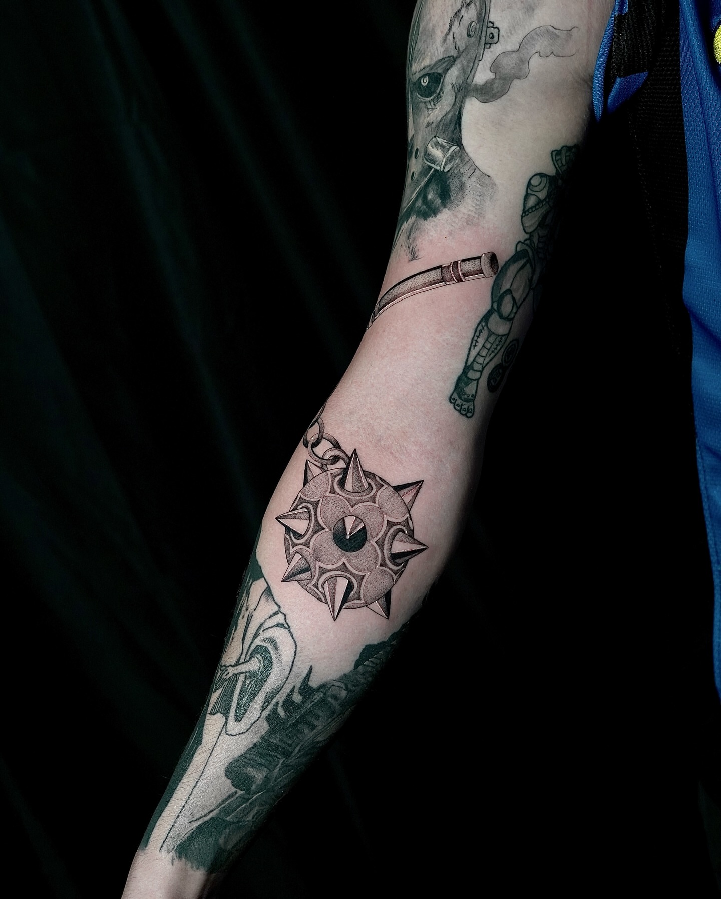 Spiked sun geometric tattoo on the forearm by Fine line tattoo San Diego, San Diego, California
