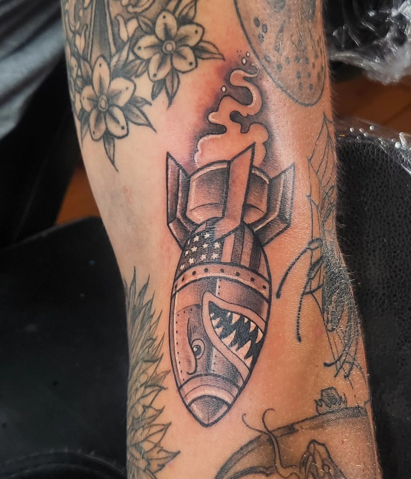 Bomb American traditional tattoo on the forearm by Audrey Luther