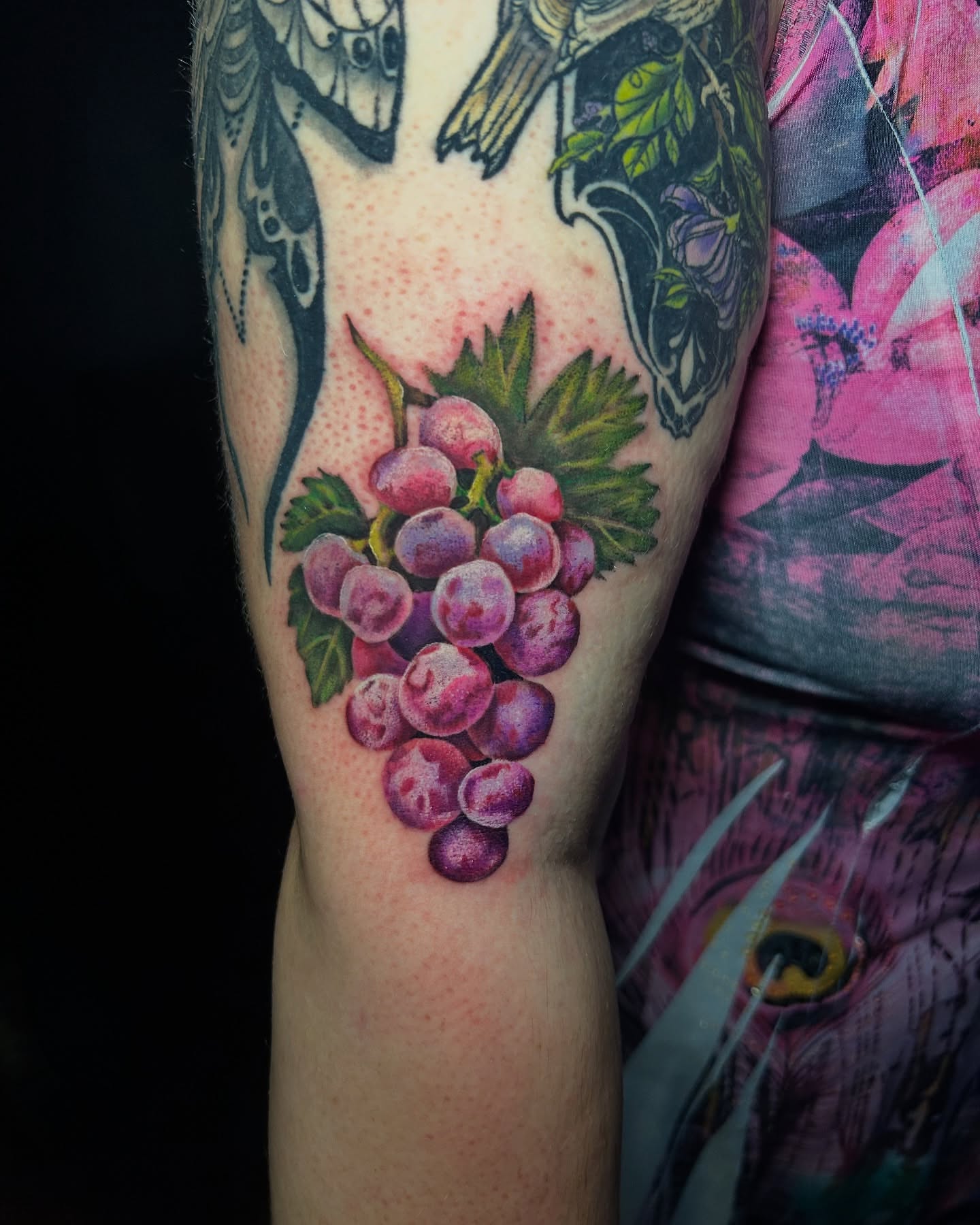 Grapes realism tattoo on the forearm by Vanessa Kendyll’s Tattoos