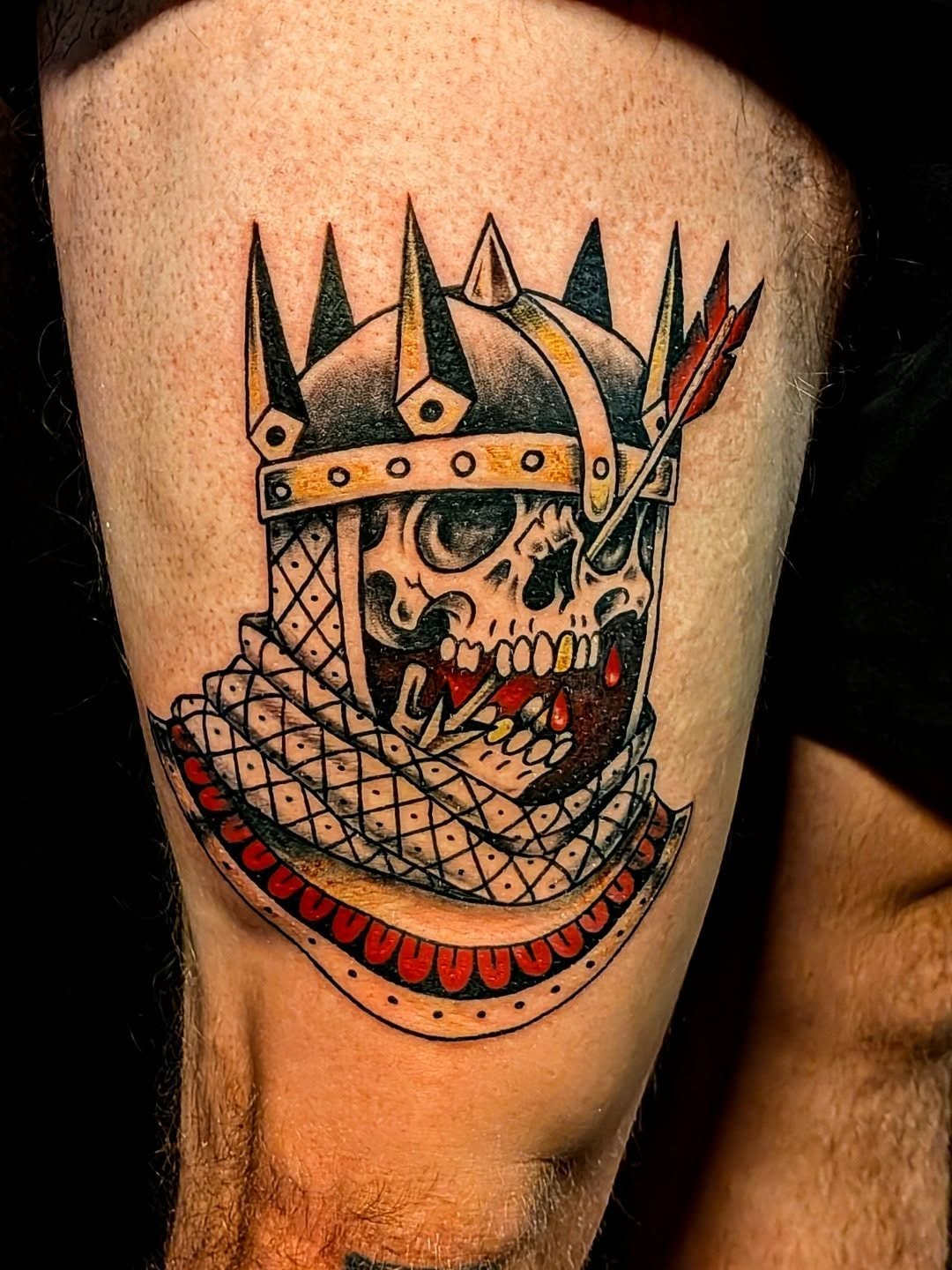 Skull wearing helmet American traditional tattoo on the thigh by Shannon