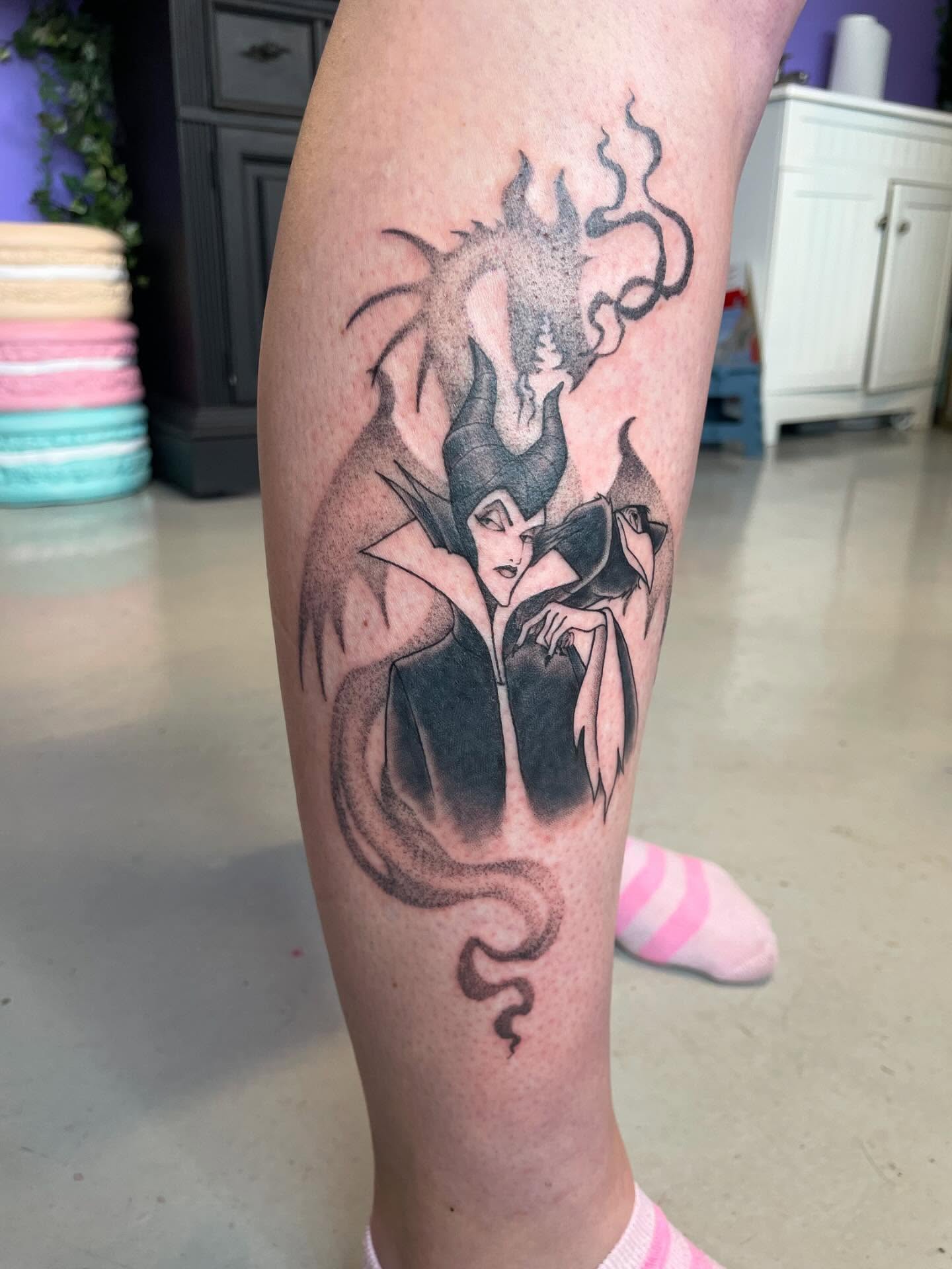 Maleficent black and grey tattoo on the forearm by Christin Baumgart