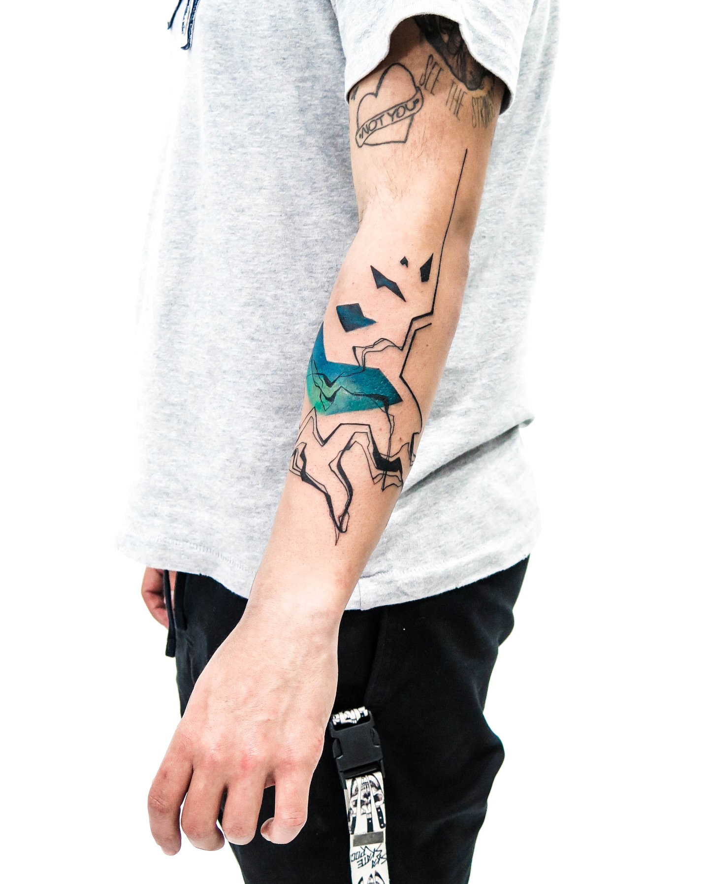 Abstract geometric shapes geometric tattoo on the forearm by Pietro Moleti