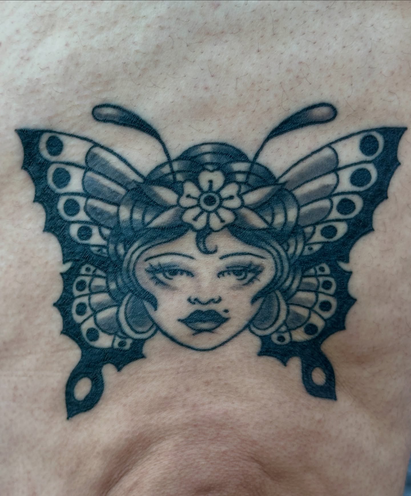 Butterfly black and grey tattoo on the chest by julian solis, Houston, Texas