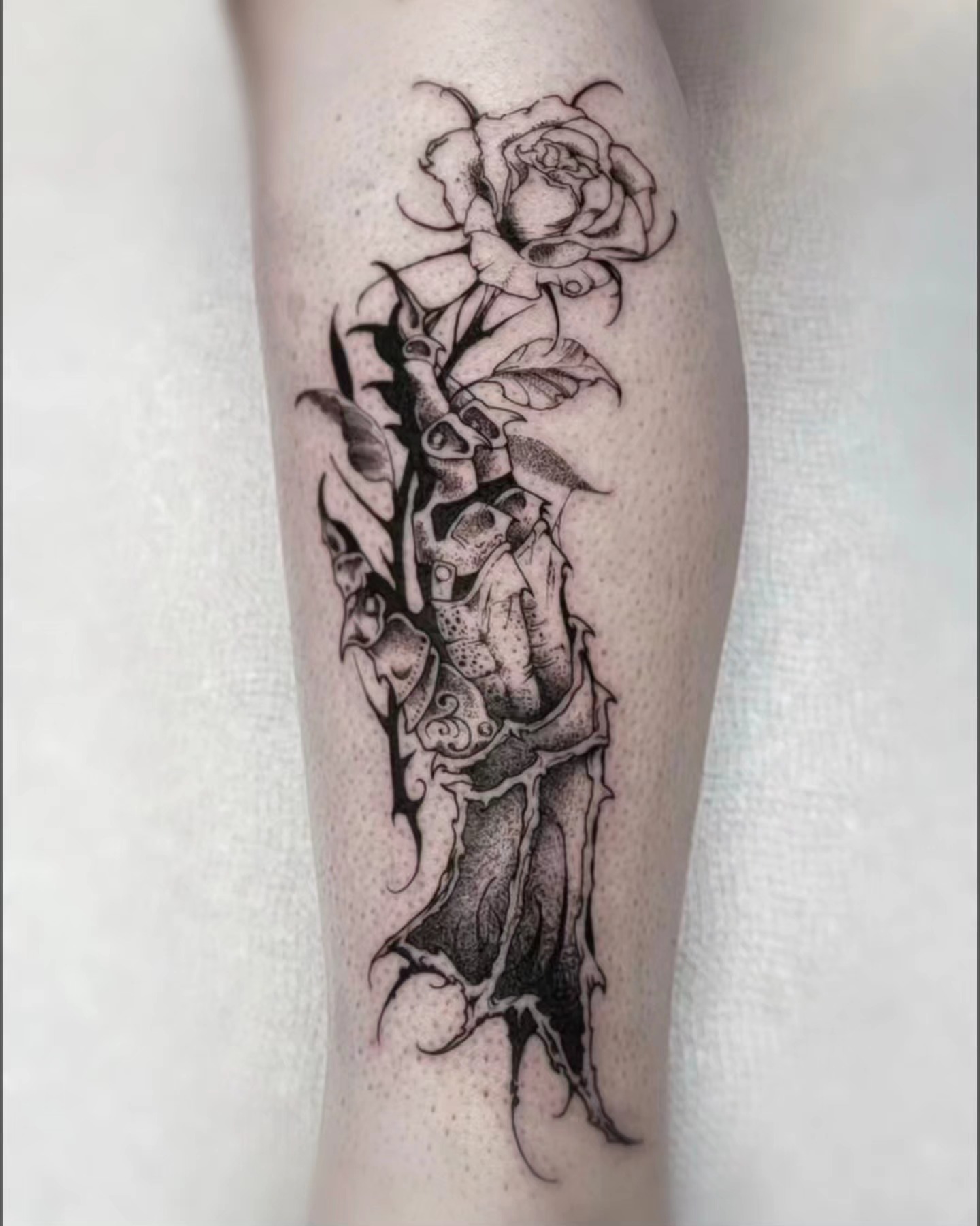 Rose and thorns dotwork tattoo on the forearm by Luca
