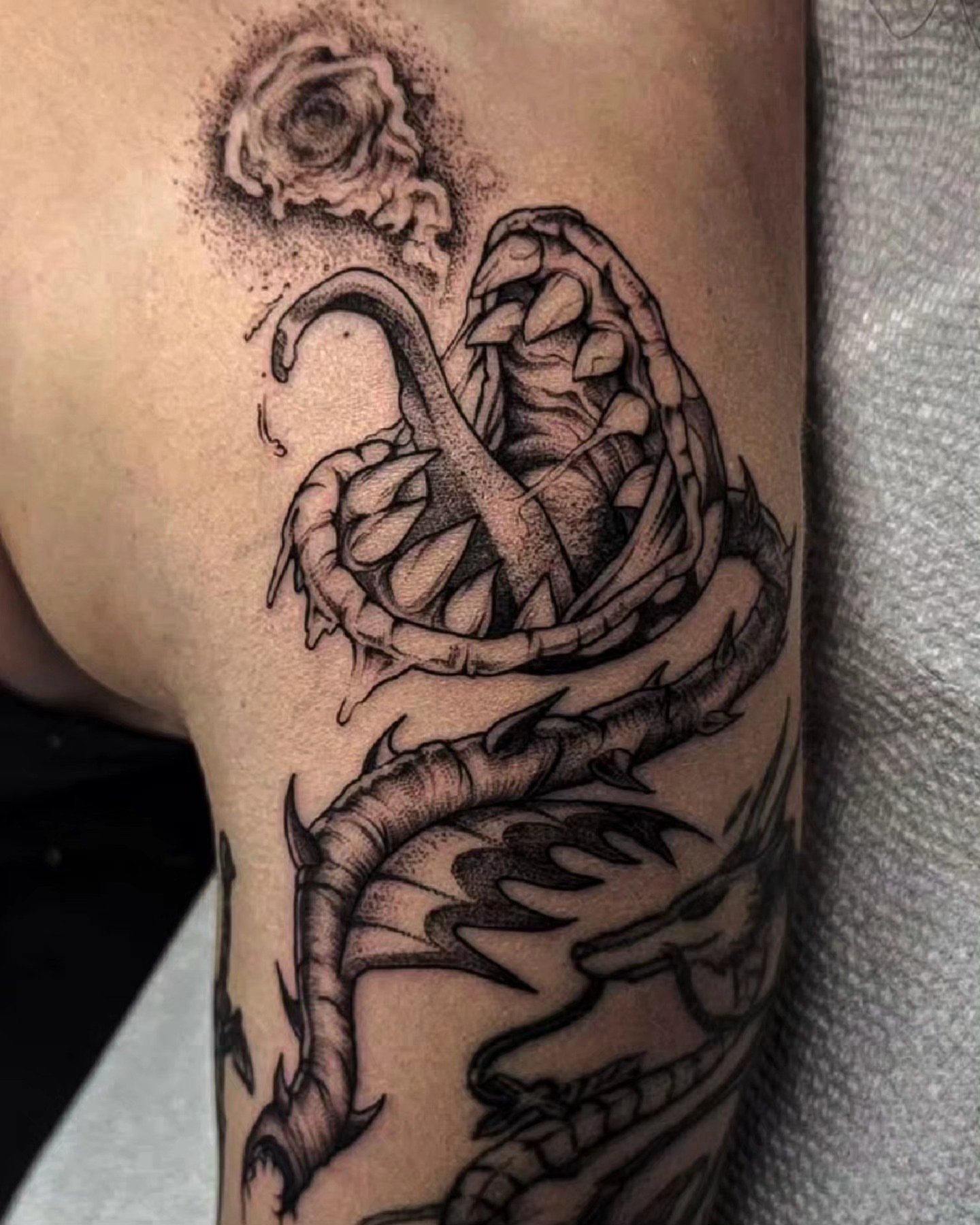 Snake and rose dotwork tattoo on the forearm by Luca